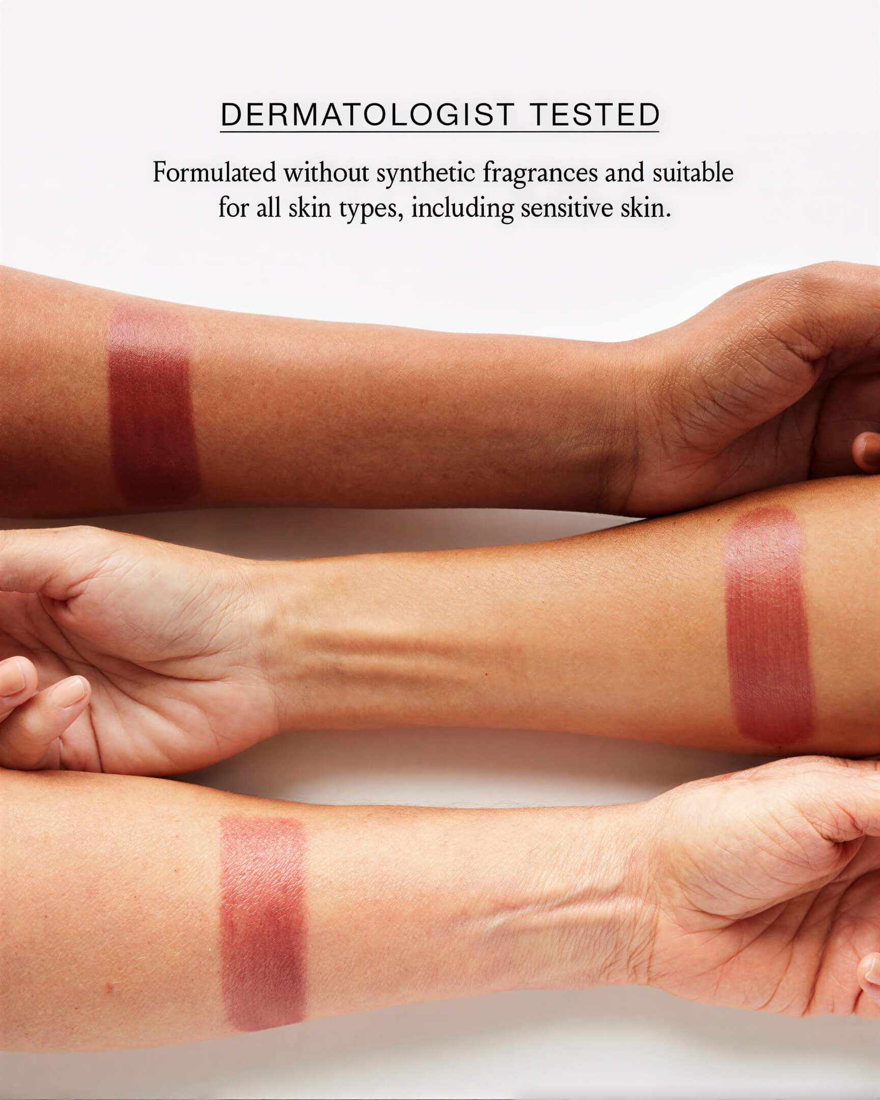 Three arms with different skin tones showing berry-colored swatches of Boomstick Color.